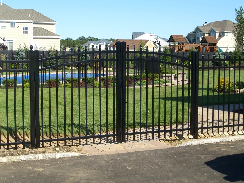 Five-foot black aluminum spear-top front gate at a residential property in Miller Place, New York.