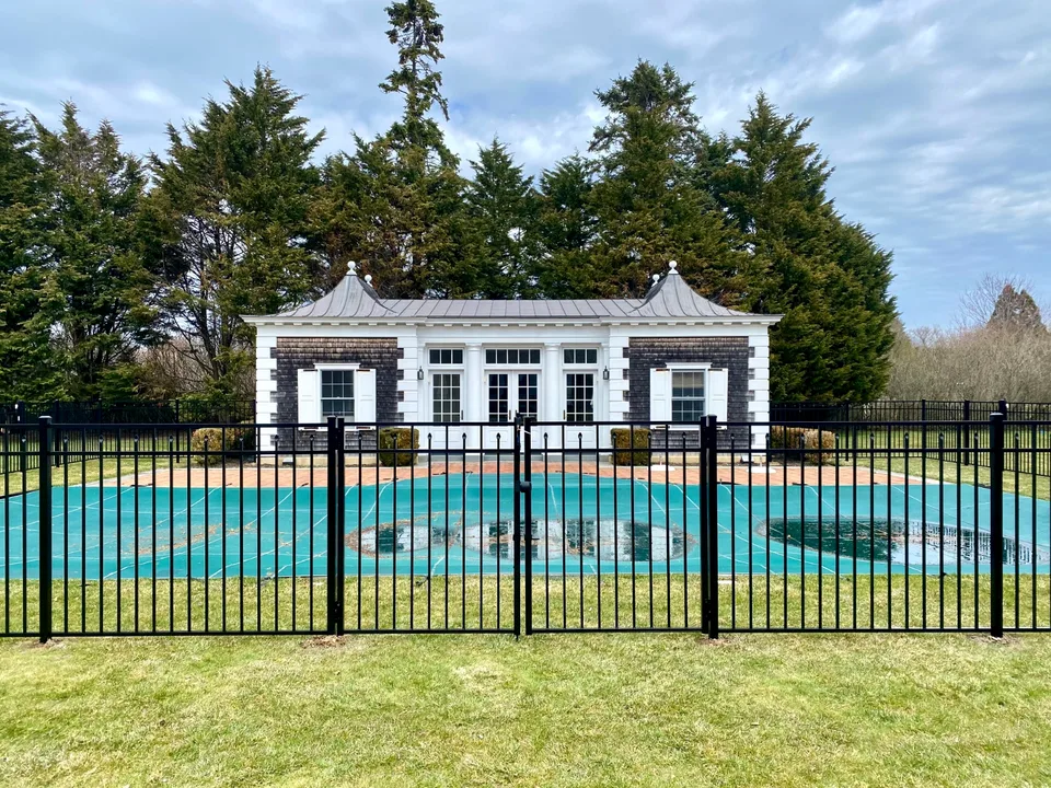 Black aluminum gate within a 54-inch Style 200 pool fence in Southampton, New York.