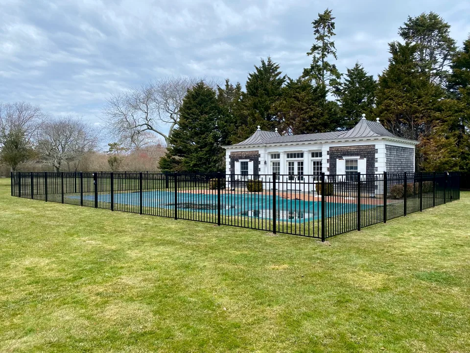 Long run of 54-inch Style 200 black aluminum pool fencing in Southampton, New York.