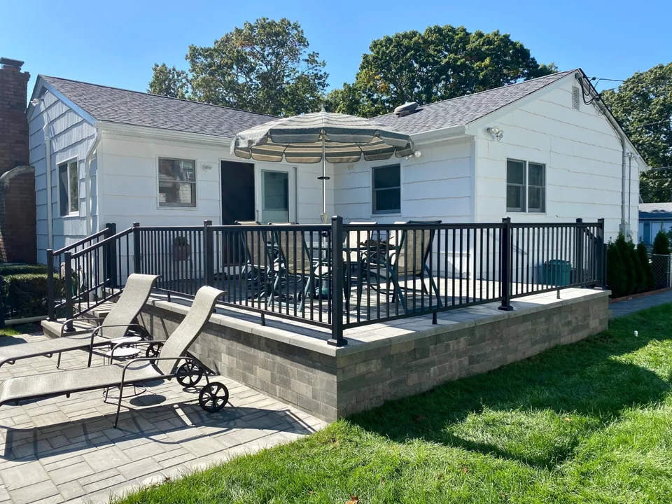 Black aluminum railing at the Bellport, New York home