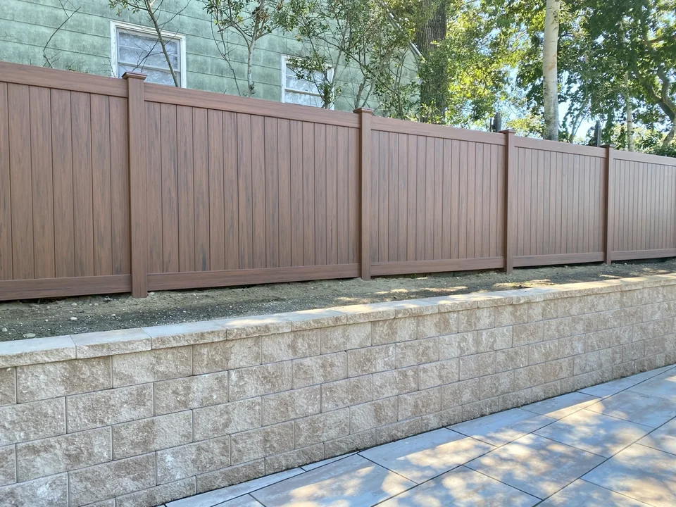 Closer genuine view of the cedargrain PVC panels and retaining-wall alignment in Sag Harbor