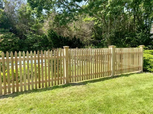 Custom cedar picket pool fence installation in Quogue, New York