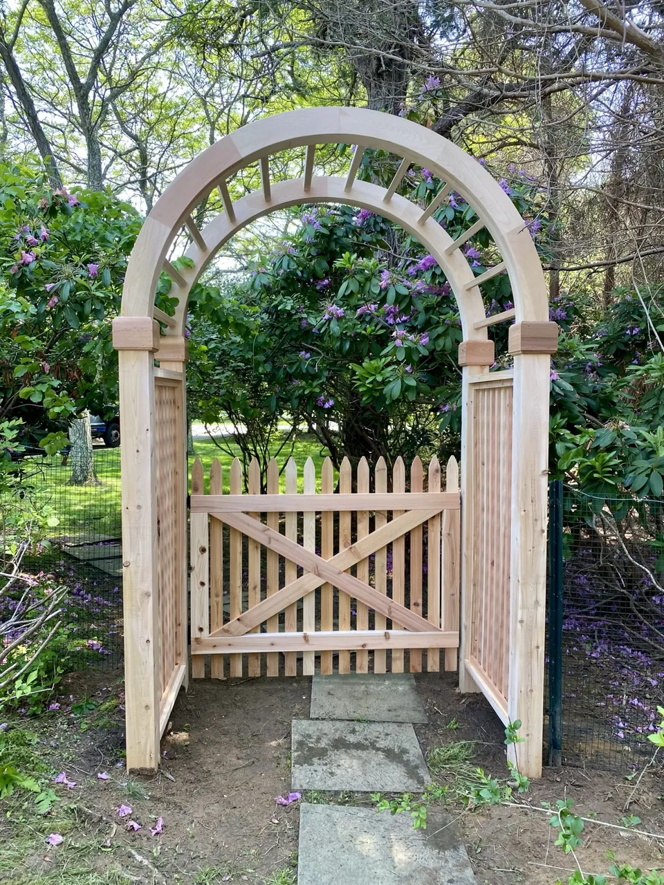 Custom cedar arbor entrance and picket pool fence replacement in Quogue New York