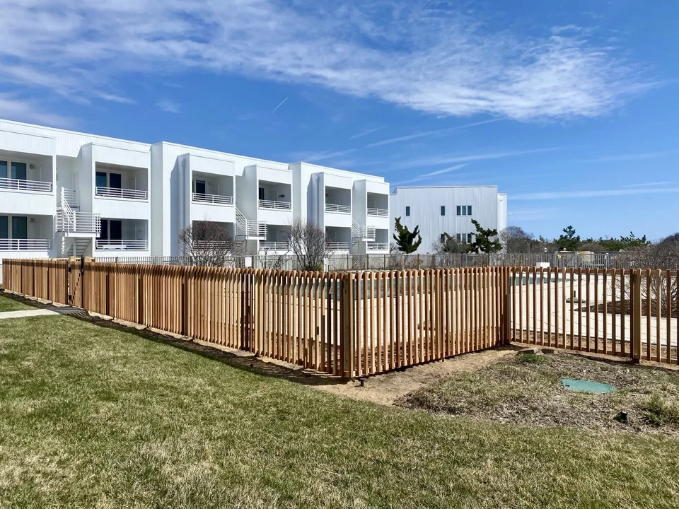 Custom cedar swimming pool fence at a condominium in Montauk New York