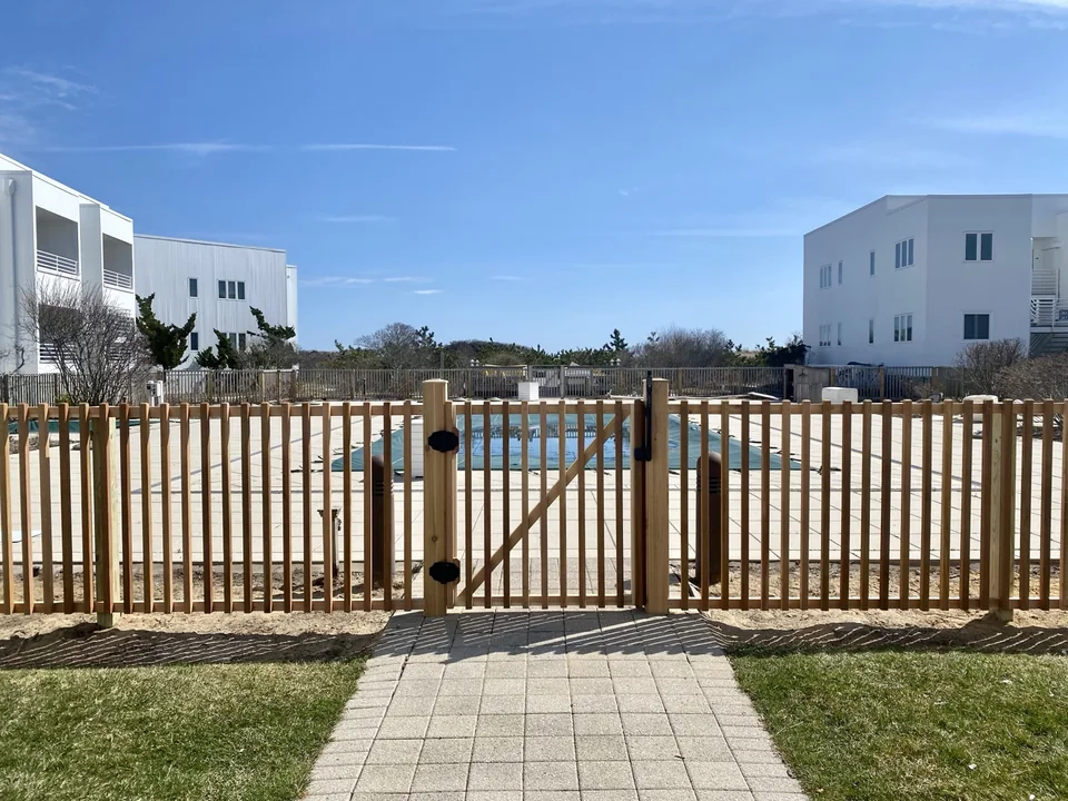 Centered custom cedar swimming pool gate in Montauk New York