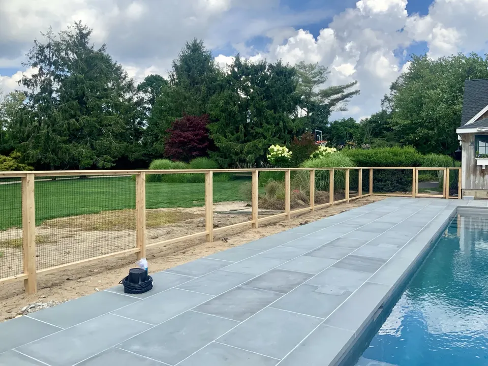 A long run of consistent cedar framing across the property