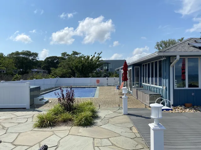 Waterfront Frameless Glass Pool Enclosure in Southold, New York