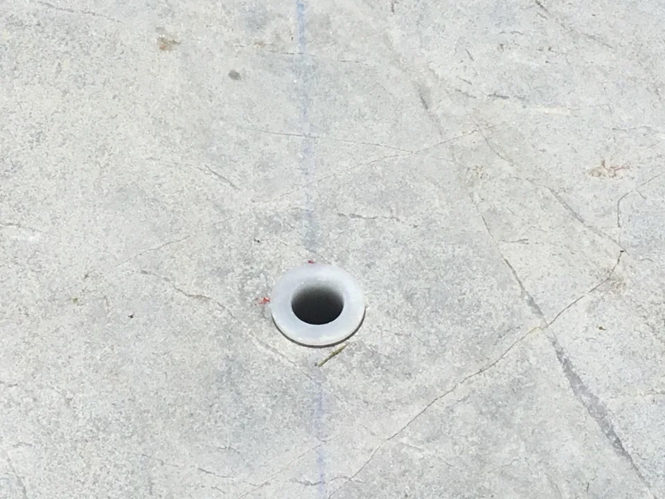 Guardian Premier 5/8-inch deck sleeve opening in finished Southampton patio