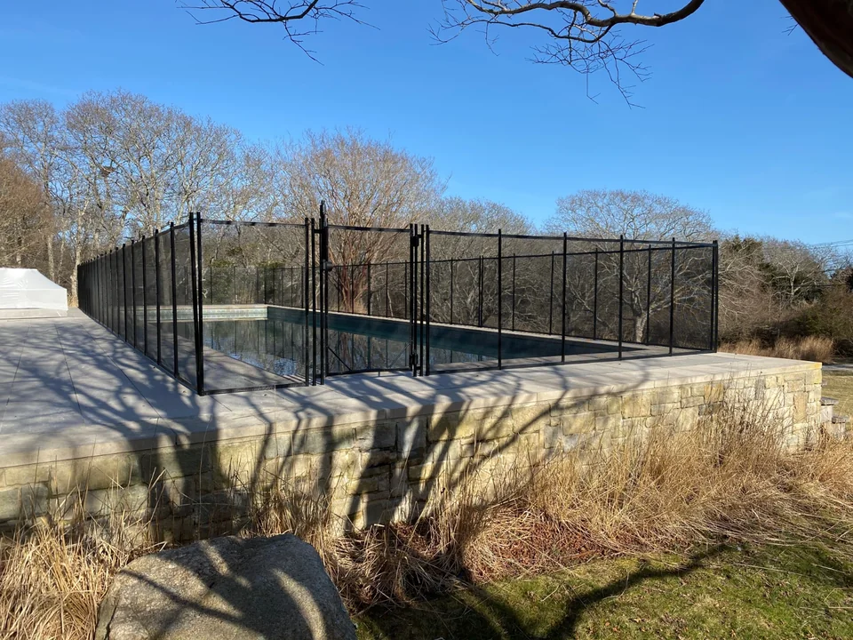Black Guardian Premier pool fence preserving views across a Montauk swimming pool