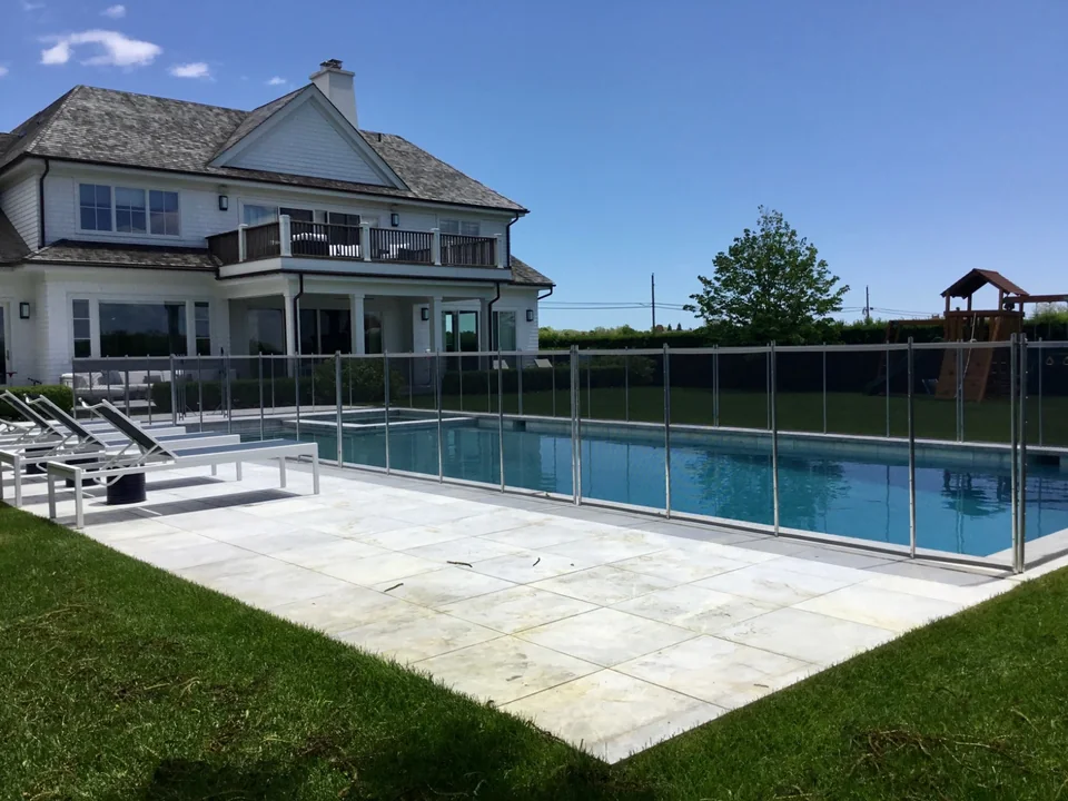 Guardian Premier removable pool fence with Southampton home beyond