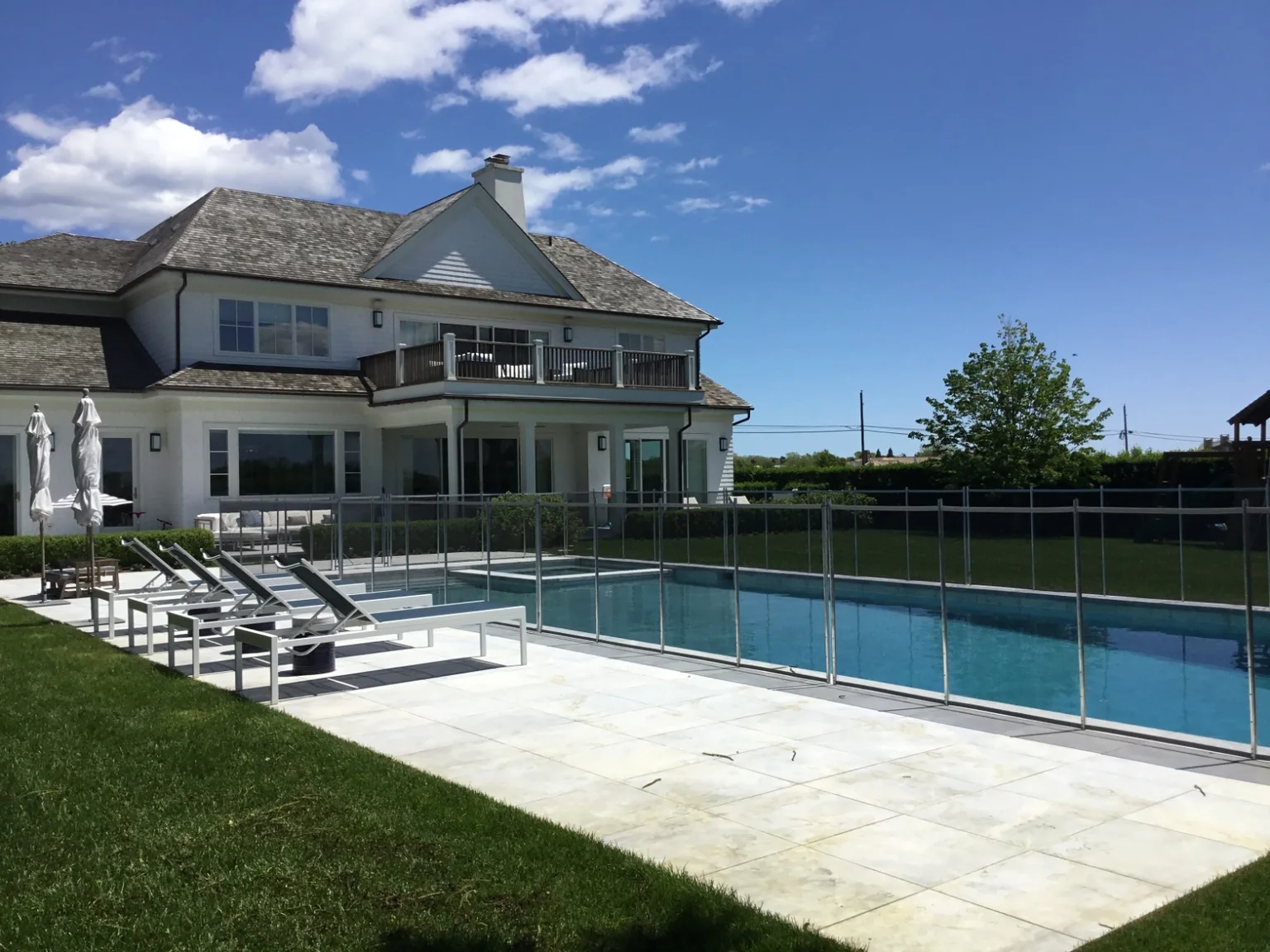 Guardian Premier Vanishing removable mesh pool fence at a Southampton, New York home