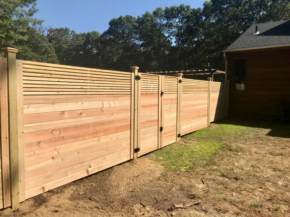 Inside view of horizontal cedar privacy fencing and custom gates in Westhampton