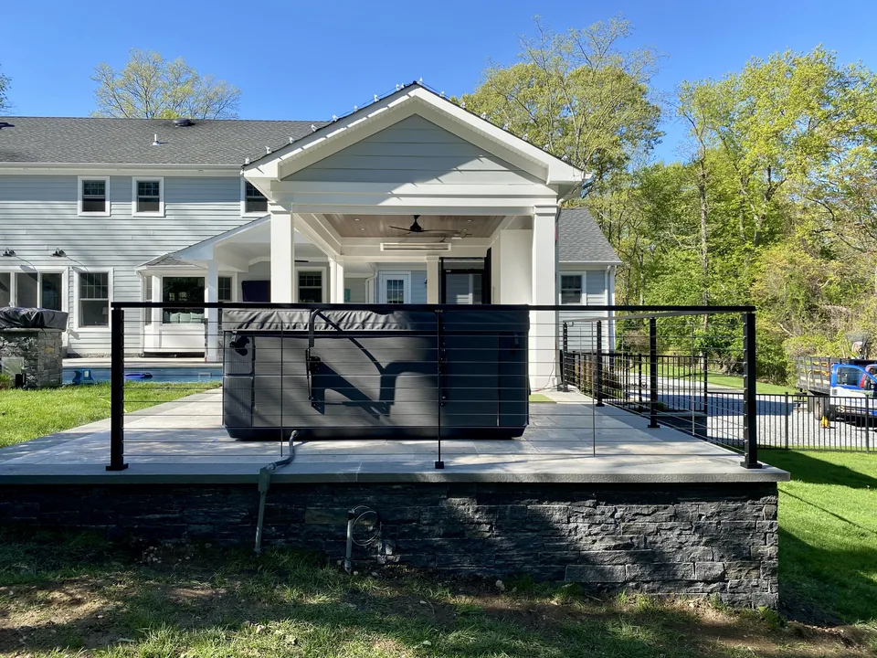 Aluminum cable railing around a raised patio in Suffolk County