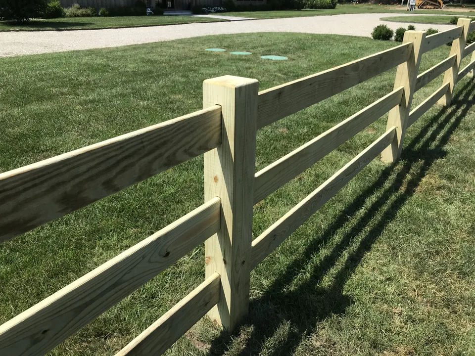 Close view of custom mortised post and rail fence construction