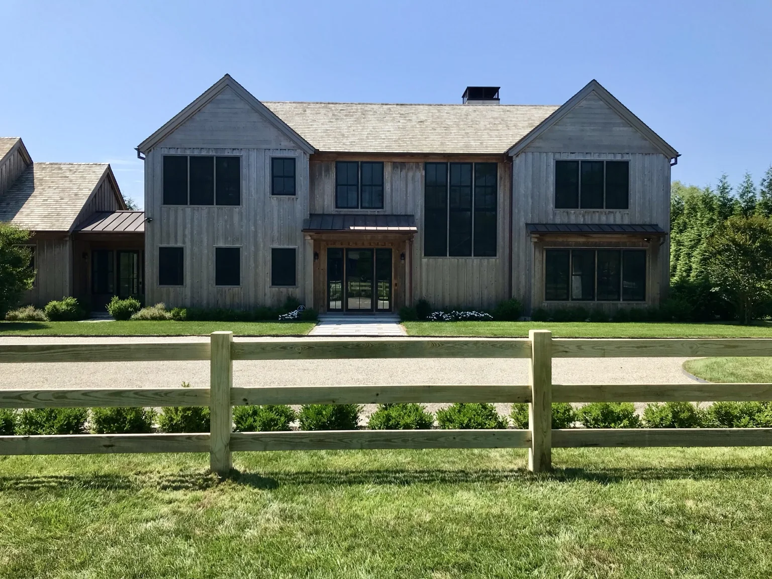 Custom pressure-treated post and rail fence at a Remsenburg NY home