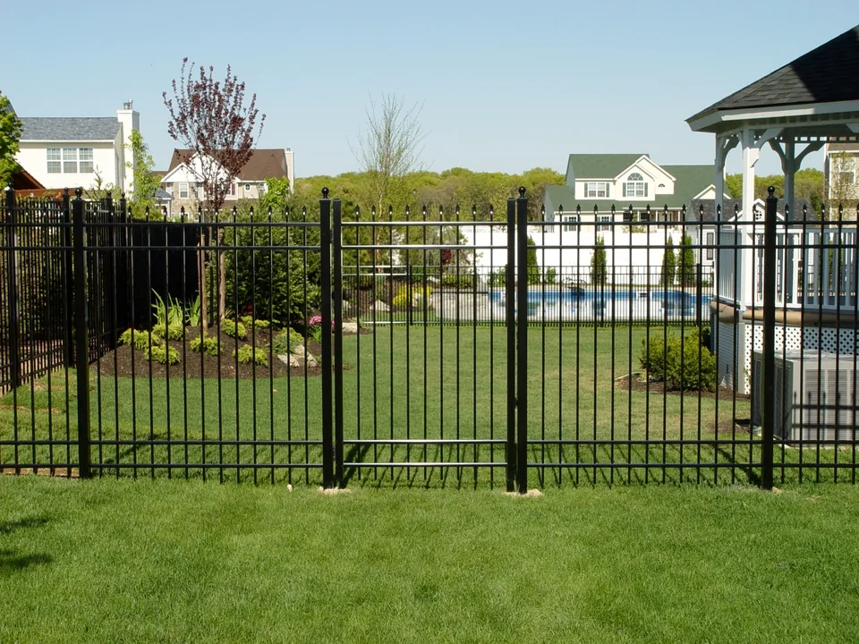 Six-foot black spear-top aluminum gate and fence at a Miller Place residence