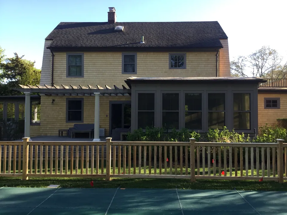 White cedar fence designed to complement a traditional Bellport Village home